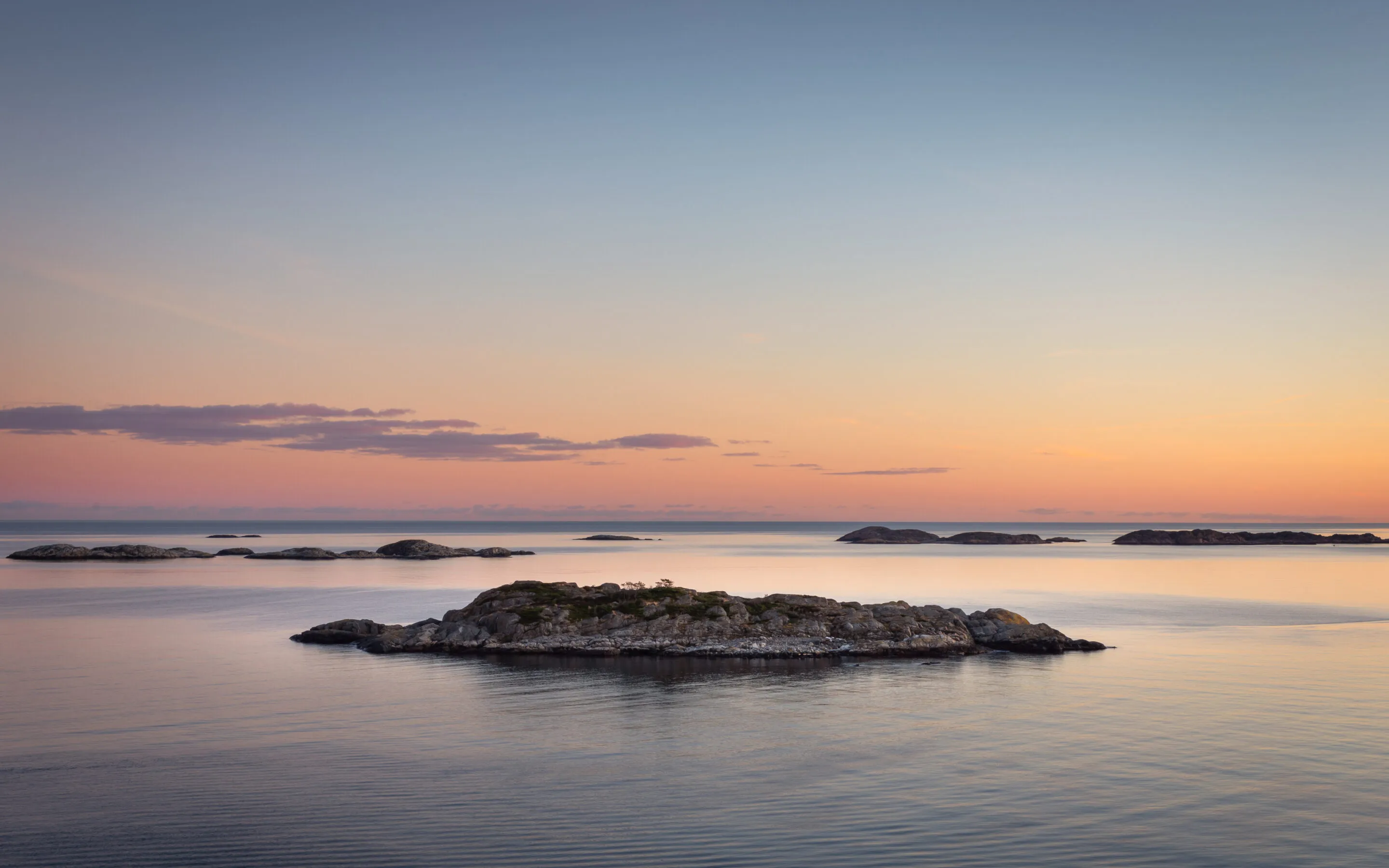 Landskap fra Sørlandskysten ved solnedgang